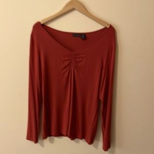 Burnt orange long sleeve v-neck - sweater like material.